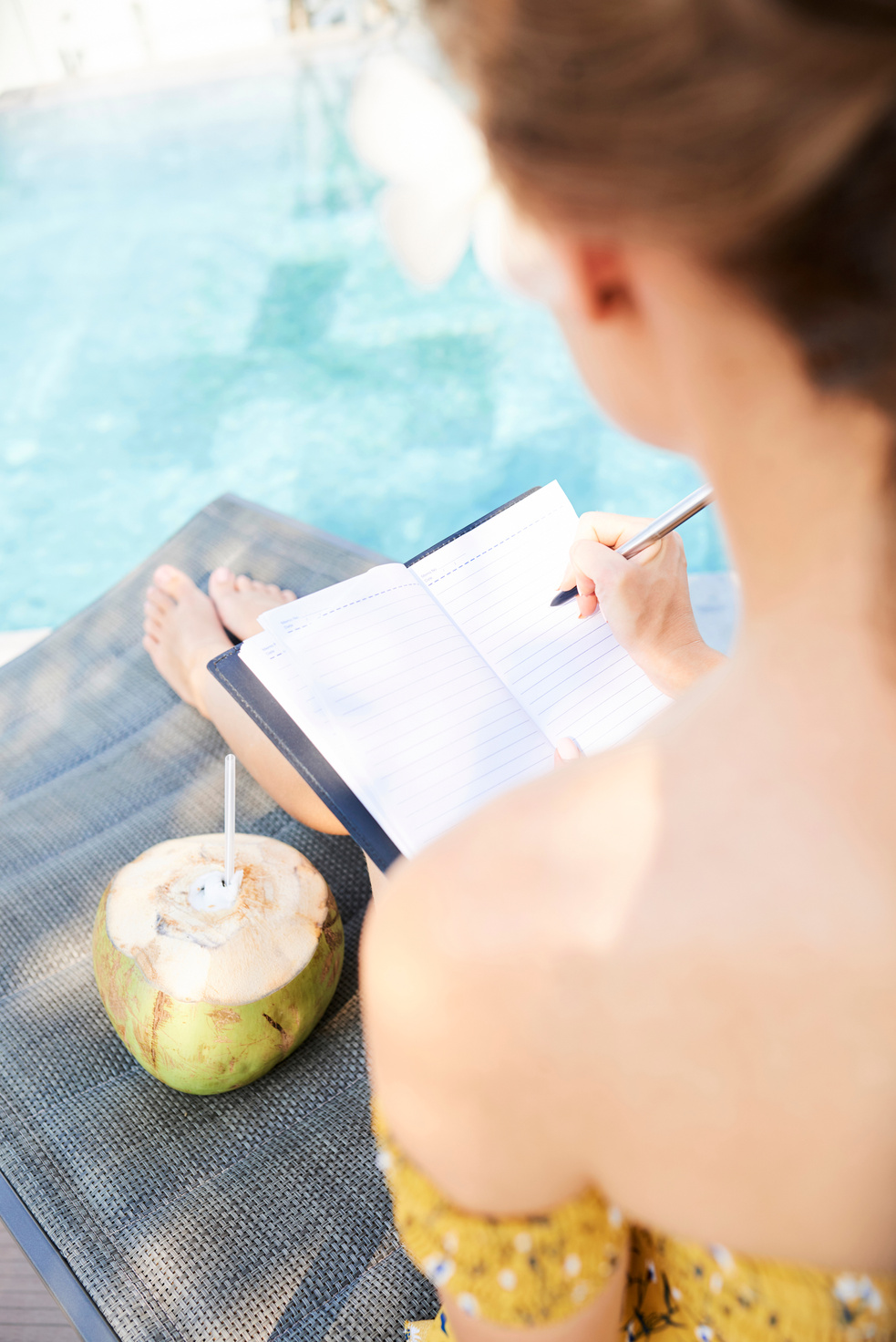 Woman filling gratitude journal